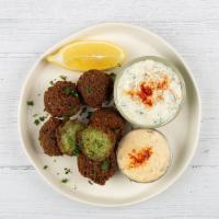 Falafel Plate · Fried falafel balls served with orzo rice, side salad, fresh pita and your choice of sauce.