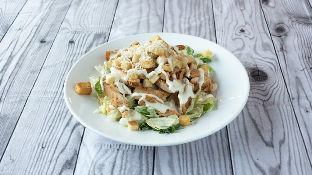 Chicken Caesar Salad · Pita bread, tomatoes, crouton, chicken, romaine lettuce, croutons and Parmesan.