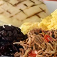 Criollo Breakfast · Two eggs cooked to order, arepa, sweet plantains, shredded beef, black beans and shredded pa...