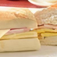 Breakfast Sandwich · Omelette sandwich made of two eggs with either ham, bacon or turkey and swiss cheese. Y