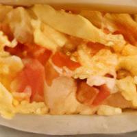 Arepa Perico · Scrambled eggs, tomatoes and onions
