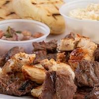 Grill Mix · Your pick of angus steak, chicken or both, along with arepitas, queso de mano, coleslaw, chi...