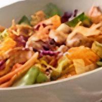 Salad Oriental · Romaine lettuce, red cabbage, carrots, mandarin oranges, tortilla strips, ginger dressing an...