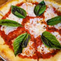 Classic Margherita Pizza · Plum tomato sauce, fresh mozzarella, fresh basil, olive oil (vegetarian)