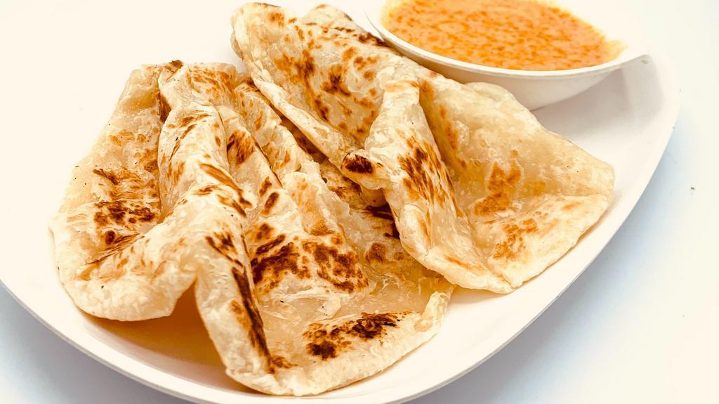 Rotti Appetizer · Perfect pan sear Thai flat bread come with yellow dipping sauce.