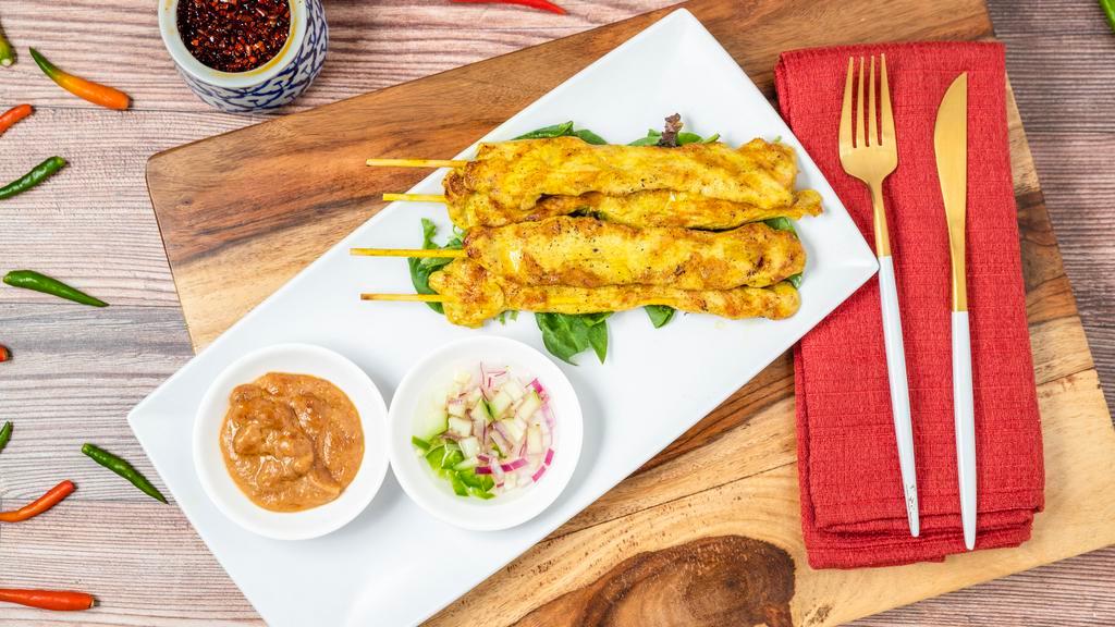 Chicken Satay · Grill marinated chicken breast on bamboo skewer, served with cucumber sauce and peanut sauce.