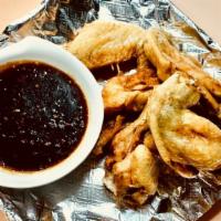 Thai Naked Wing · Deep fried crispy wing with home made sauce.