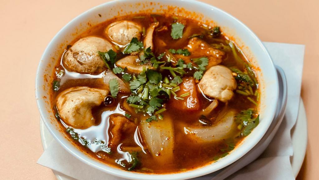 Tom Yum Soup · Thai hot and sour soup. Cooked with onion, tomato, mushroom, basil and cilantro.