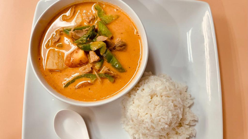 Roast Duck Curry · Gourmet roast duck in spicy red curry sauce combined lime leaves and cooked with potato, tomato, bell pepper and basil. Comes with steamed rice. More spicy.