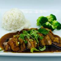 Thai Spice Roasted Duck · Slice duck meat topped with home made duck sauce , comes with steamed broccoli and steamed r...