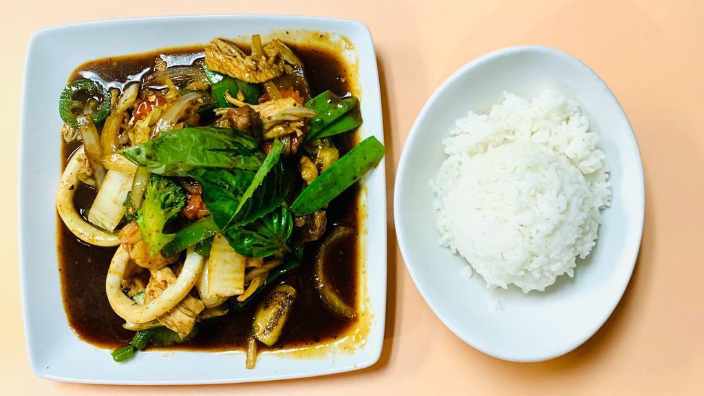Love Me Long Time · Sautéed seafood and meats combination, mix vegetable included Thai eggplant and slice bamboo with spicy garlic sauce, serve with side of steamed rice. Spicy dish.