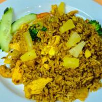 Pineapple Fried Rice · Stir fry rice with egg, broccoli, tomato, onion, cashew, pineapple and Thai curry powder.