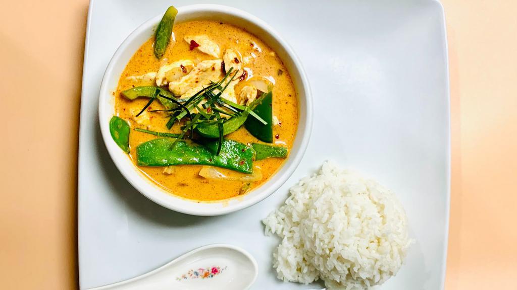 Panang Curry · Prevalent in southern Thailand, just across the border from Malaysia. Cooked with bell pepper ,snow pea, onion, and garnish with thin slice lime leaf. Comes with steamed rice. More spicy.