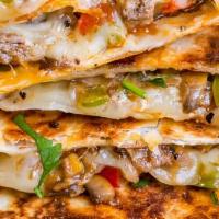 Philly Cheesesteak Quesadilla · Thinly slice steak, sautéed onions, peppers, mushrooms and cheese.