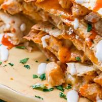 Buffalo Chicken Quesadilla · Seasoned grilled chicken, buffalo wing sauce, ranch dressing and cheese all mixed up togethe...