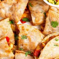 Fried Chicken Quesadilla · Fried Chicken, pickles and cheese.