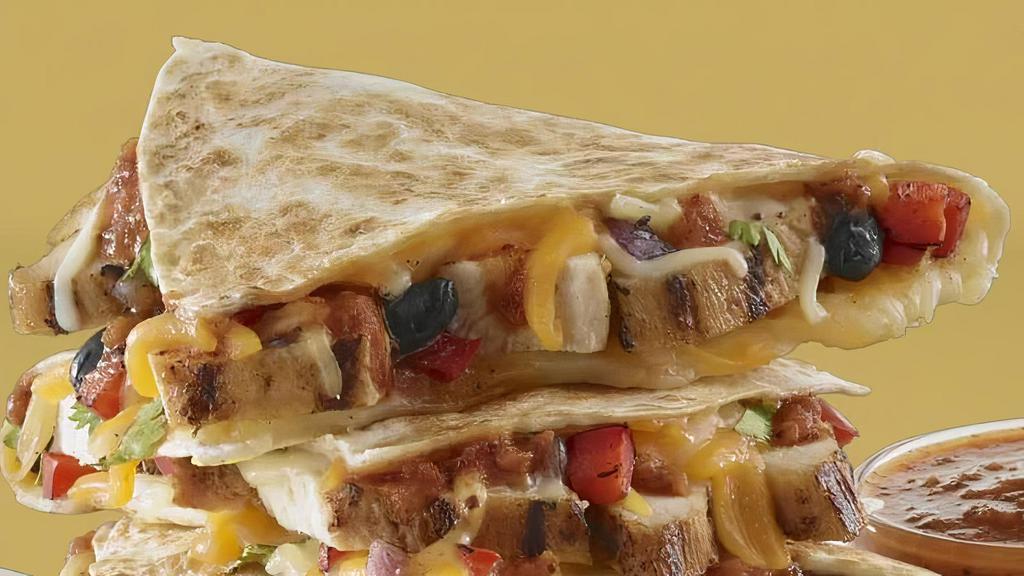 Jamaican Me Crazy Quesadilla · Shredded Caribbean chicken, black beans, onions, peppers with our cheese blend.