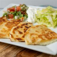 Quesadilla Appetizer · Grilled flour tortilla stuffed with grilled chicken and cheese. Served with lettuce, sour cr...