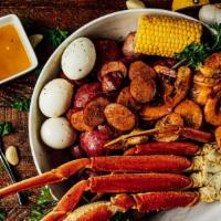 Lemon Butter Feast · 1 Cluster Snow Crab, 1/2 LB. Shrimp, Sausage, 3 Boiled Eggs, and Your Choice of 2 Sides with...
