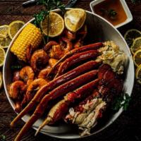 Seven Seas Special · 1 Cluster Snow Crab leg; 1/2 LB  headless shrimp; 6 OZ Lobster Tail; Your Choice of 2 Sides ...