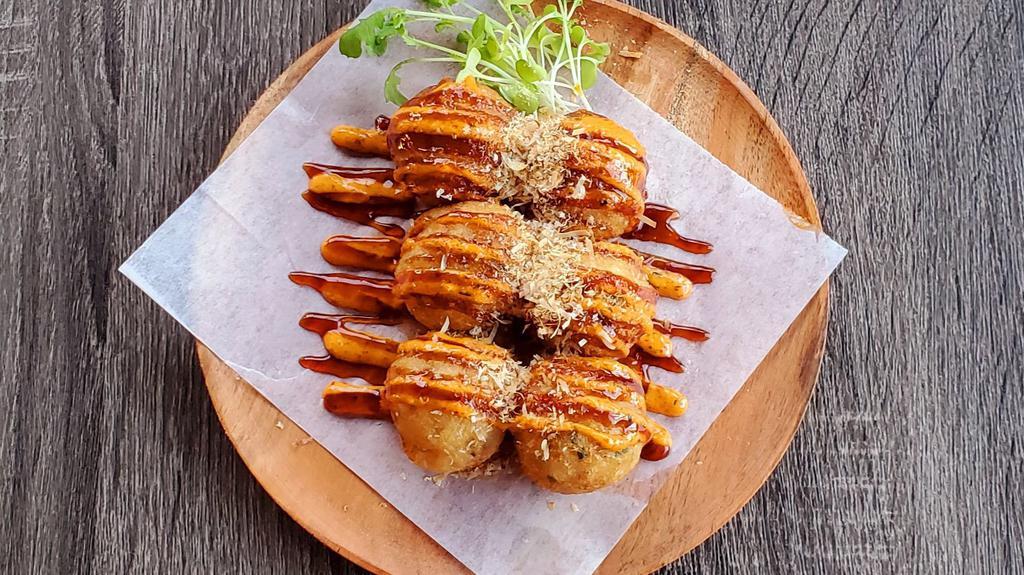 Spicy Takoyaki (6 Pcs) · Spicy octopus fritters, eel sauce, spicy mayo, and bonito flakes.