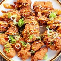 Chicken Karaage · Twice fried chicken dark meat, spicy mayo, and eel sauce topped with sesame seeds and scalli...