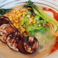Veggie Tan Tan Ramen · Roasted eggplant, scallions, bok choy, miso butter corn, grated garlic, chili oil. Served wi...