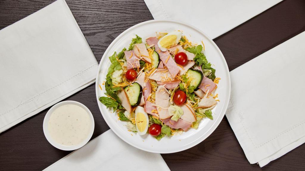 Chef Salad · Romaine lettuce, Boar's Head Ham, Turkey & Cheddar Cheese cucumbers, grape tomatoes and red onions with ranch dressing.