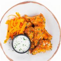 Sweet Heat (6/12) · Wings roasted to perfection and tossed with hot sauce, butter, and brown sugar. Served with ...