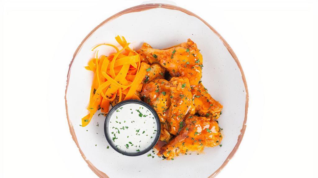 Sweet Heat (6/12) · Wings roasted to perfection and tossed with hot sauce, butter, and brown sugar. Served with a side of ranch.
