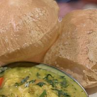 Poori Bhajji · Whole wheat bread served with potato masala.