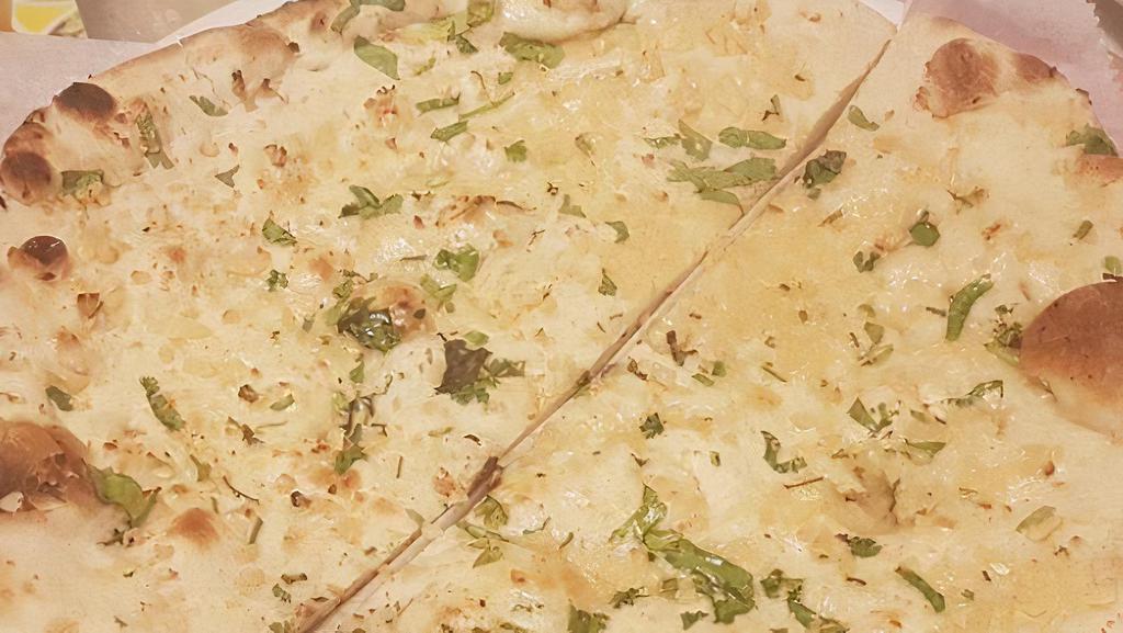 Garlic Naan · Baked with fresh garlic brushed with butter.