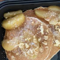 Banana Pannies · 2 banana pancakes served with maple syrup, banana slices, butter, and dusted with powdered s...