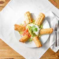 Taquitos · Four crisp flour or corn tortillas (two beef and two chicken) served with guacamole salad.