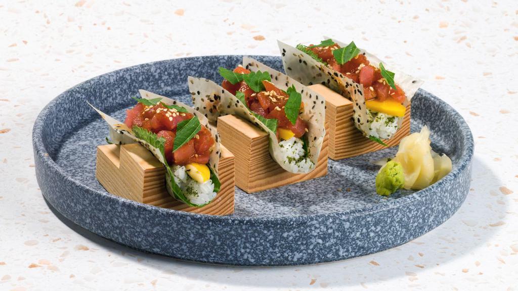 Spicy Tuna Sushi Tacos · Three hand-held, wrapped tacos with marinated ahi tuna, sriracha mayonnaise, fresh shiso.