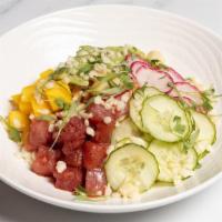 Ahi Tuna Poke Bowl · Jasmine rice, soy marinated ahi tuna, avocado, cucumber, radish, mango, macadamia nuts.