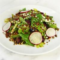 Spring Greens + Grains · Romaine +  mixed greens, quinoa almond crumble, red grapes, radish, feta, tossed in an orang...