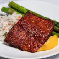 Cajun Oven Roasted Atlantic Salmon* · Blackened salmon with confit garlic butter, spring onion rice and seasonal vegetables.