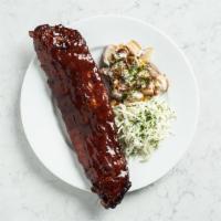 Bbq Ribs · Tender pork, braised low and slow, with warm potato salad, smoky bacon, coleslaw.