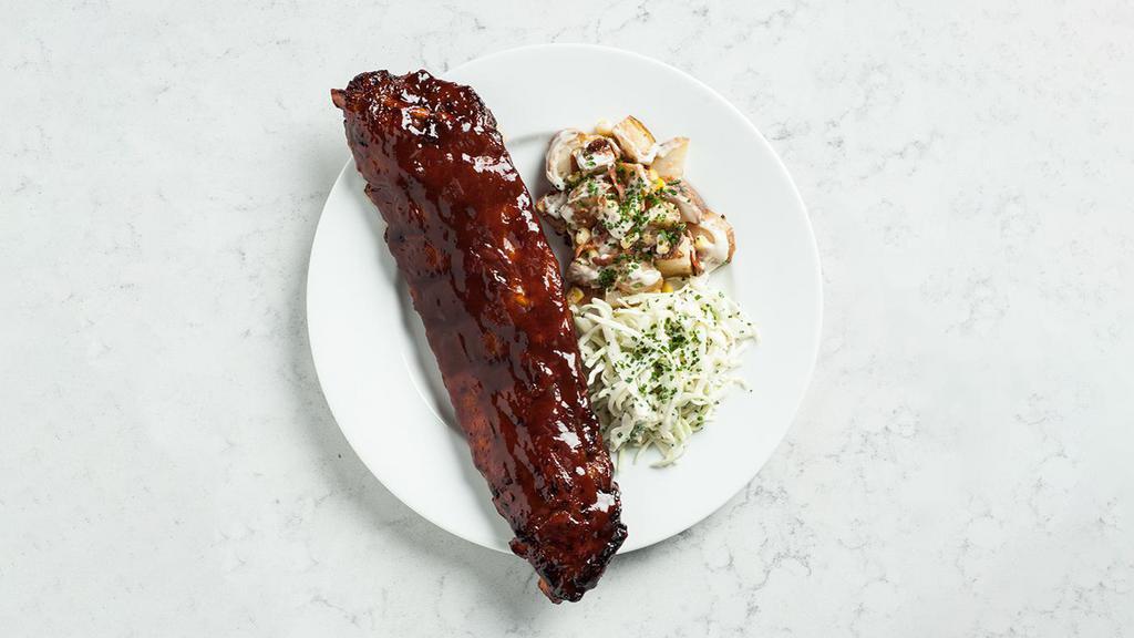 Bbq Ribs · Tender pork, braised low and slow, with warm potato salad, smoky bacon, coleslaw.