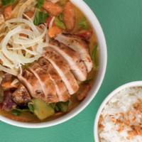 Thai Chicken Curry Bowl · Coconut curry, Thai marinated chicken, mushrooms, steamed jasmine rice, crispy onions