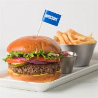 Impossible Burger · 100% plant based burger, tomatoes, onions, lettuce, pickles, mayonnaise and mustard, on a to...