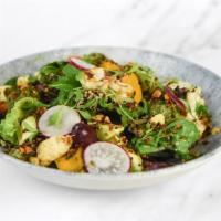 Vegan Mother Earth Bowl · Crisp romaine lettuce, mixed greens, roasted yams + cauliflower, quinoa almond crumble, broc...