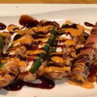 Yammi Jalapeño Roll · (Fried roll) Tempura-style jalapeno with crabmeat & cream cheese top with yammi sauce.