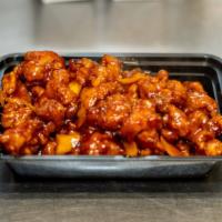 Orange Chicken · Hot and spicy. Chunky chicken tenderly fried then sautéed in hot pepper with orange sauce wi...