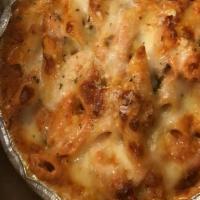 Baked Ziti Penne · pasta covered with a mixture of rich ricotta cheese, homemade tomato sauce, melted mozzarell...