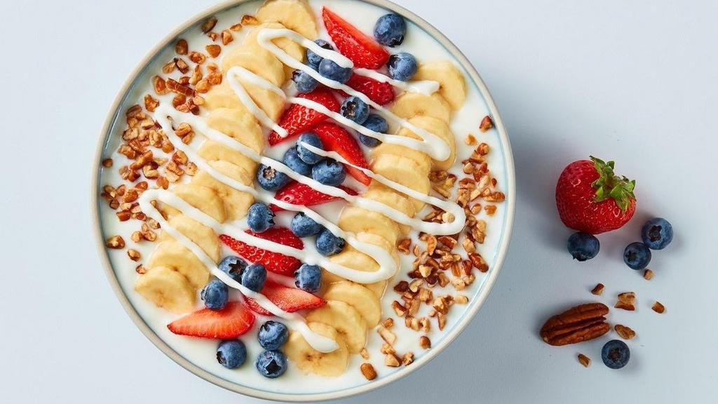 Very-Berry Banana Bowl · Packed with strawberries, blueberries and banana slices all atop our creamy vanilla yogurt, sprinkled with pecans and drizzled with sweet supreme cream.