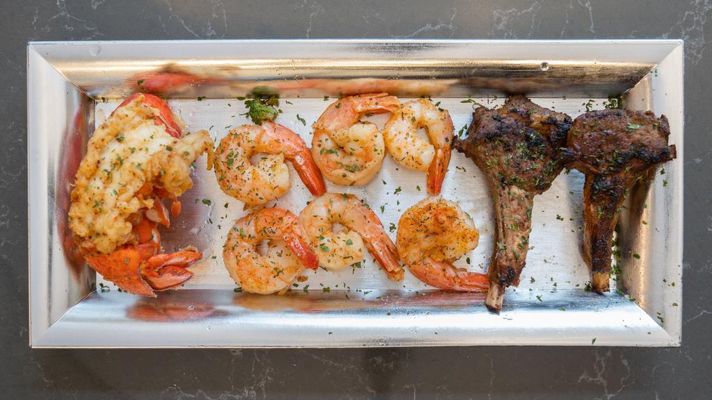 Surf And Turf · Lobster tail lamb chops and shrimp with 2 sides