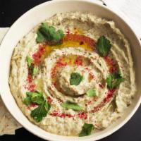 Baba Ghanouj · Mashed cooked eggplant, mixed with tahini, olive oil, lemon and various seasonings.