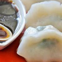 Vegetable Dumplings (8 Pc) · rice flour wrap filled with cabbage, carrots, mushrooms.